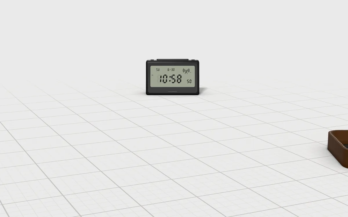 Illustration of the 5 watches to scale, next to a radio-controlled desk clock and a leather valet tray for size