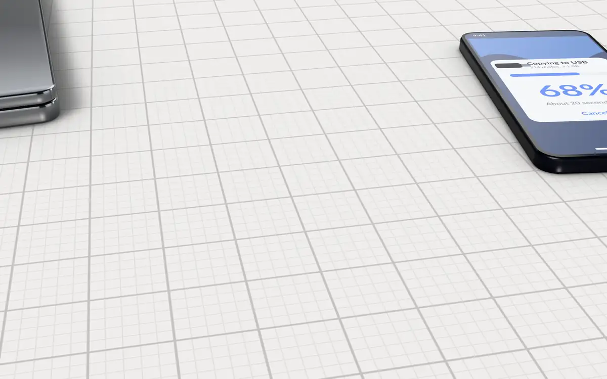 Illustration of the 5 USB flash drives to scale, next to a phone copying files and a closed laptop for size