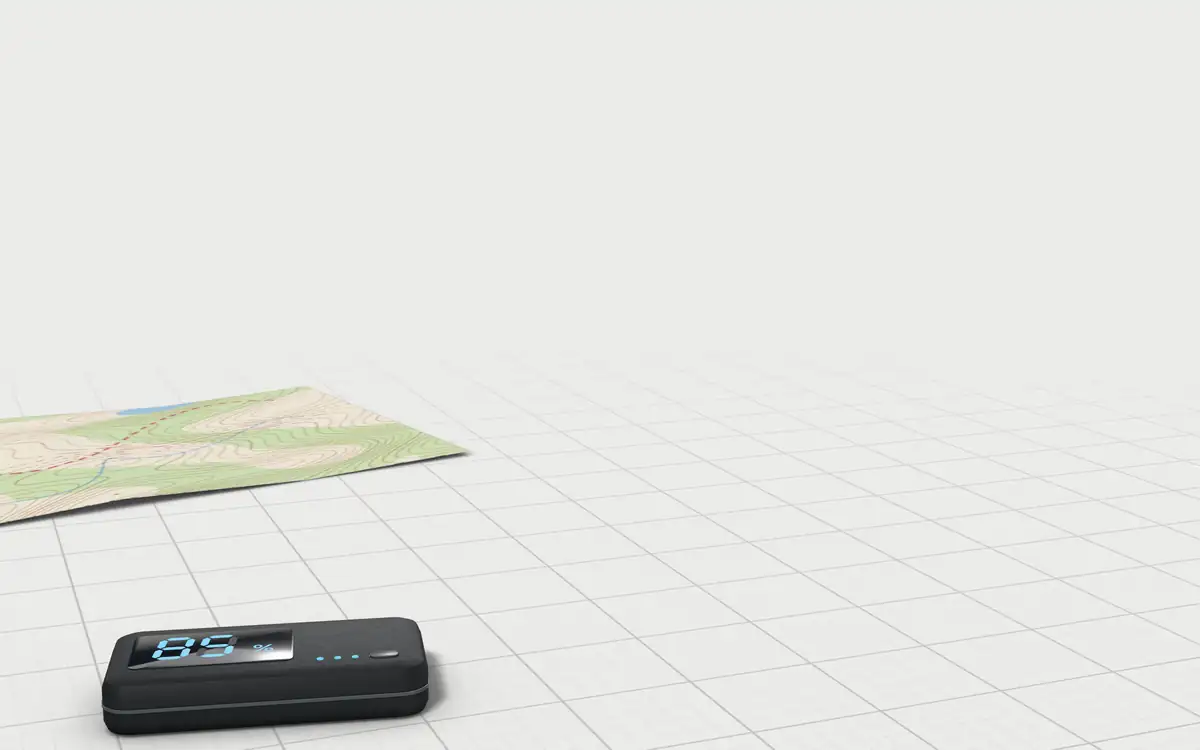 Illustration of the 5 long-distance walkie-talkies to scale, next to a folded topographic map and a power bank for size